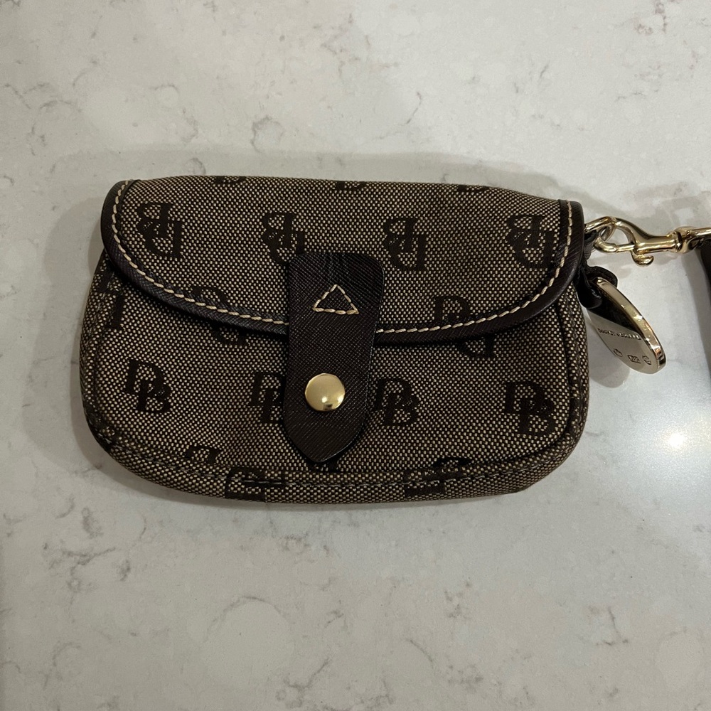 Dooney & Bourke wristlet, brown, snap closure, excellent condition.